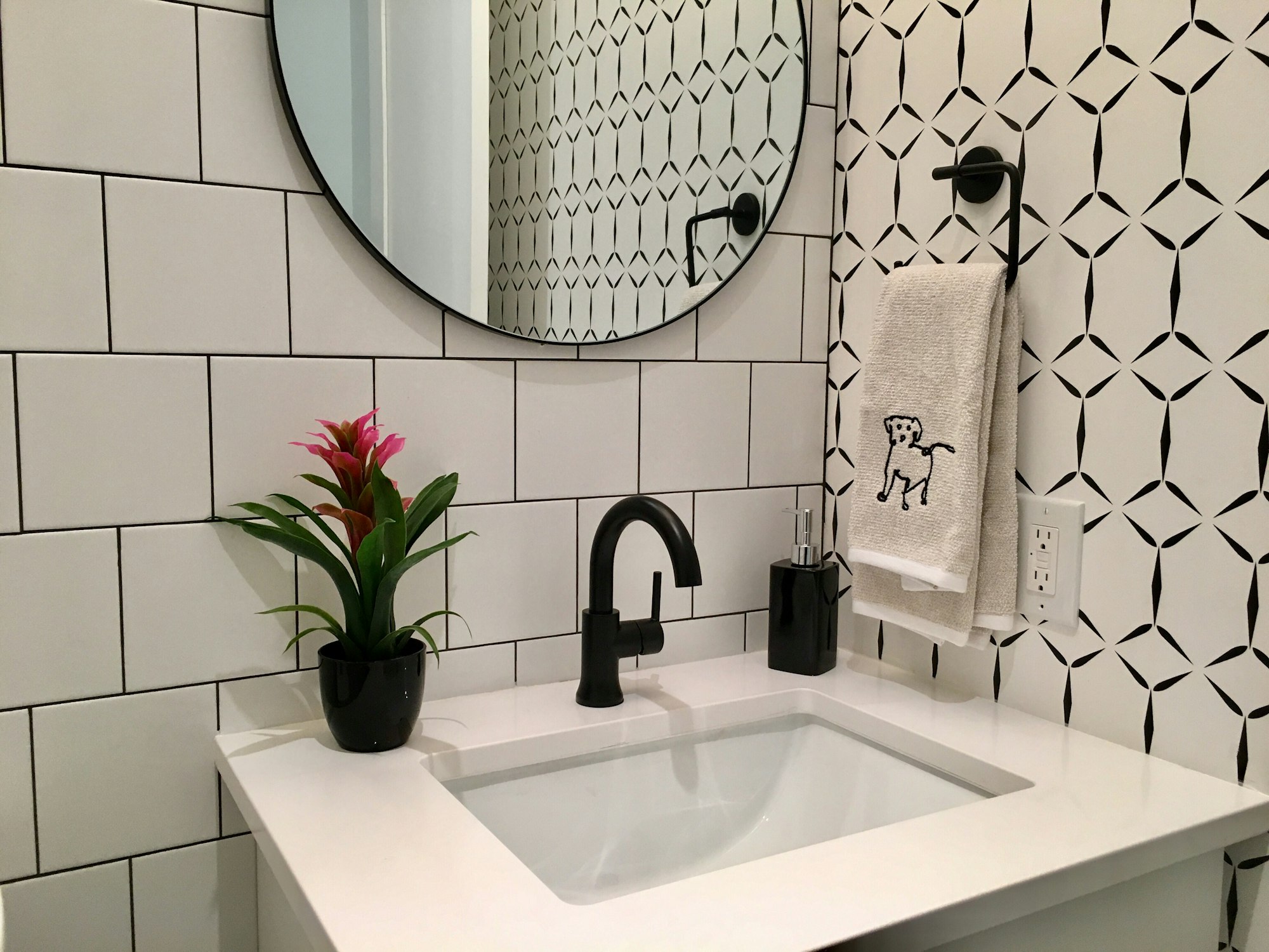 Modern bathroom design in sharp black and white contrast and striking geometrical patterns